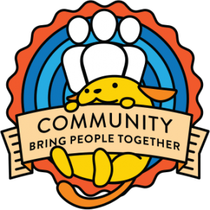 Wapuu, WordPress mascot, holding up a sign saying "Community: Bring people together"